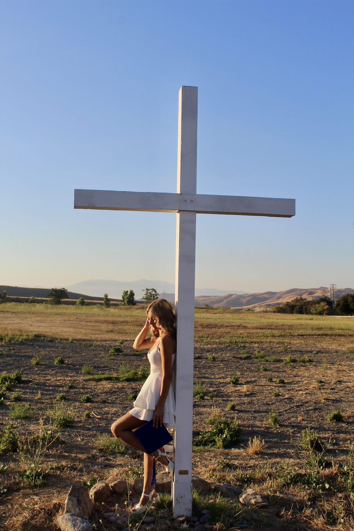 Graduation portrait — white cross